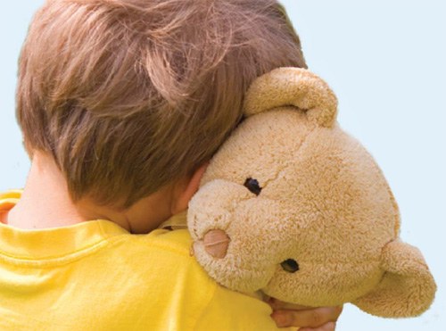 Child Hugging Teddy Bear