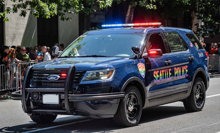 An image of a Seattle Police Department's police vehicle with the Safe Place logo.
