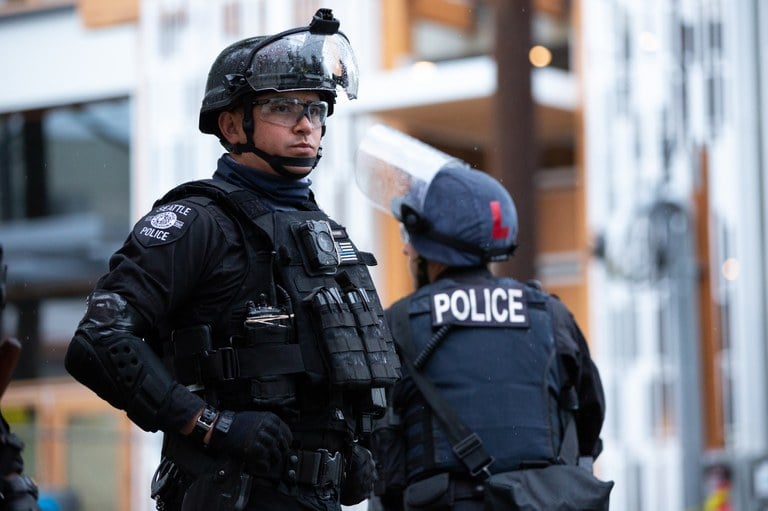 A stock image of a police officer in riot gear.