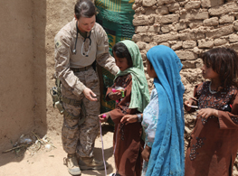 Soldier with Children in Iraq