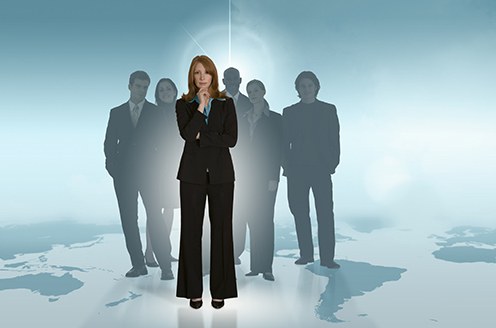 Woman and Others Standing on a Map (Stock Image)