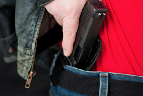 Gun in Waistband of Jeans (Stock Image)